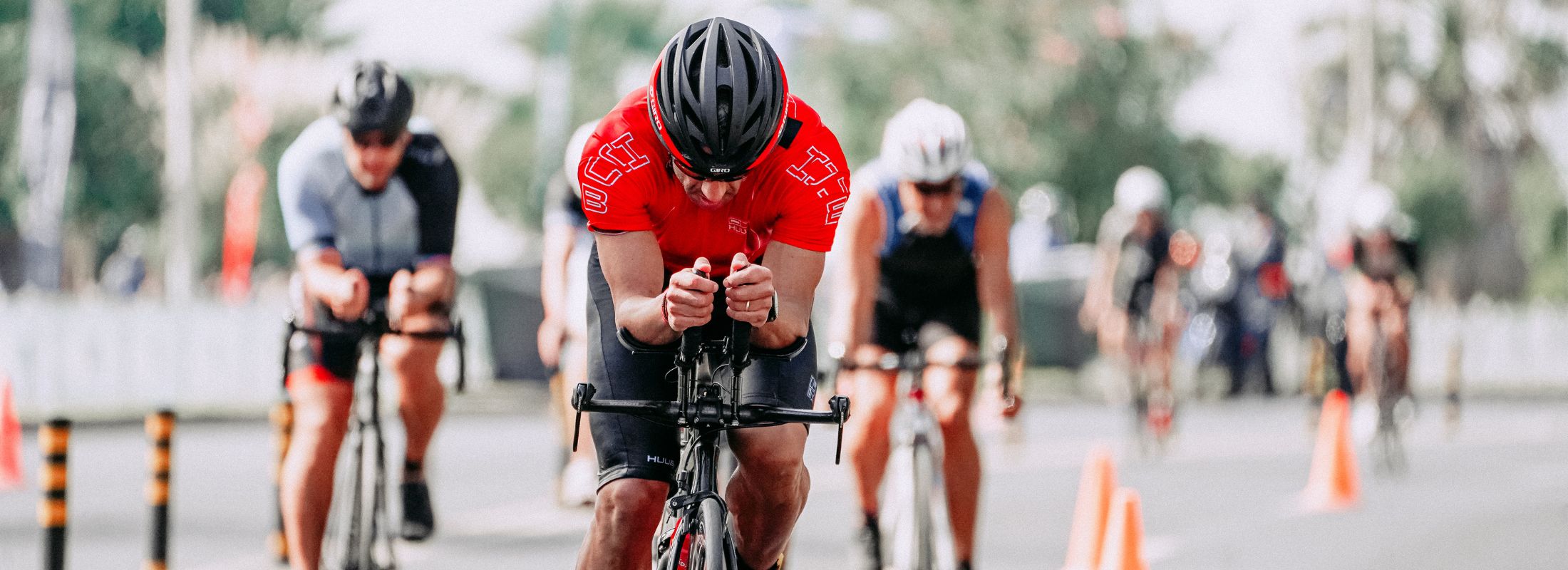 Cyclists riding in a race. Challenge Canberra Triathlon is back in November 2024